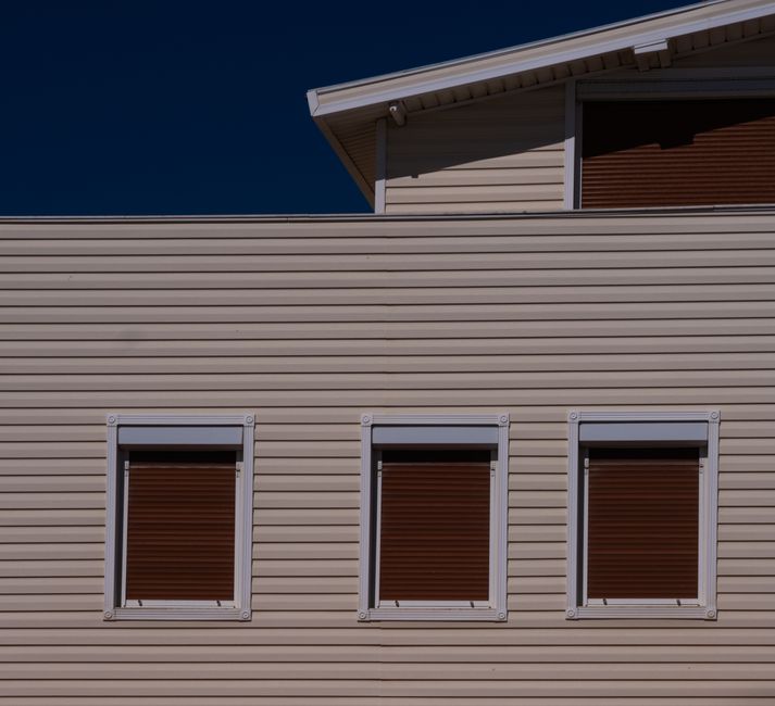 Newly installed vinyl siding on a modern home